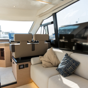 NL1413-12V electric TV lift built into yacht cabinetry, motorised wall-mounted system for flat screens, ideal for optimising space on board.