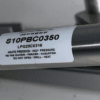 Close-up view of the AT7382 marine-grade stainless steel gas strut for NOVAL companionway hatch systems, showing the cylinder body with product label and spherical rod end fitting. S10PBC0350 Ressorts Spec