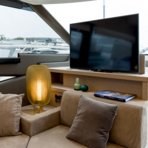 NL1177-24V electric TV lift built into yacht cabinetry, motorised wall-mounted system for flat screens, ideal for optimising space on board.