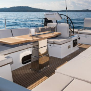 3-stage electric stainless steel table lift NL2636 installed on a yacht, showing adjustable telescopic pedestal for marine table conversion