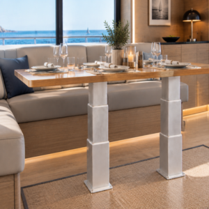 Electric table lift kit NL2388-PAIRE-T installed in a yacht saloon with sea view - two synchronized 3-stage rectangular aluminium legs supporting a wooden dining table in front of a U-shaped settee